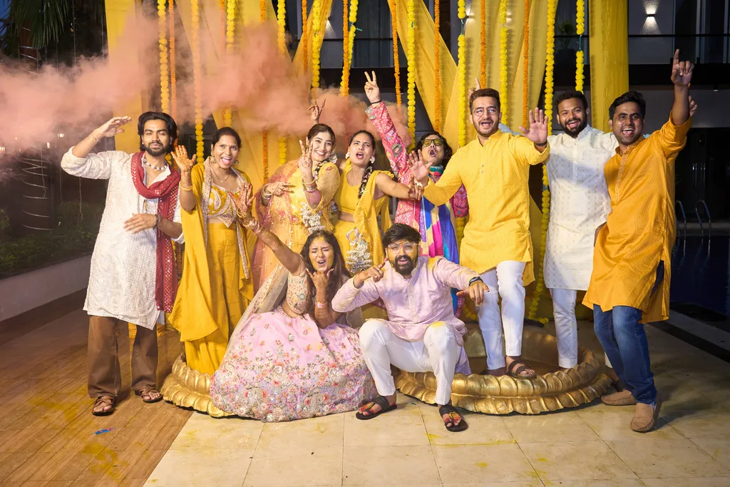 Haldi group photo with family and friends in yellow at Hotel Divine Banaras, Varanasi